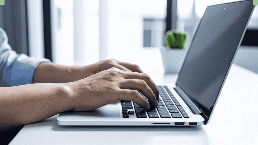 A focused writer typing a short story on a laptop